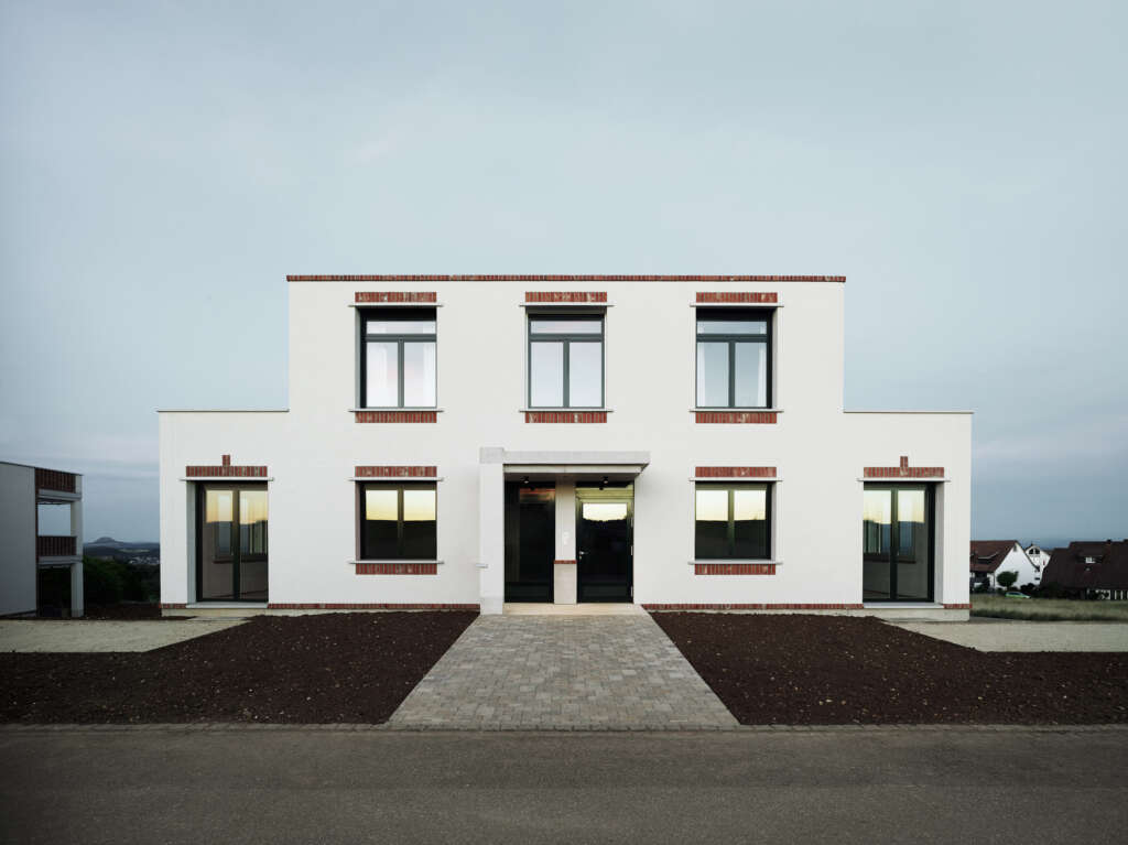 idArchitekt.innen membangun tiga bangunan apartemen bata dan beton di Swiss